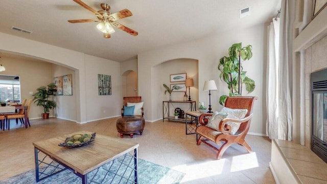 851 Vista Patron Dr, Bernalillo, NM 87004 - living area featuring arched walkways, ceiling fan, and light flooring
