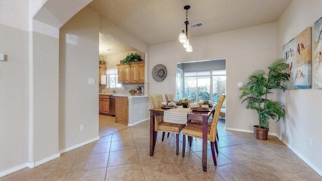851 Vista Patron Dr, Bernalillo, NM 87004 - dining space featuring light tile patterned floors and baseboards