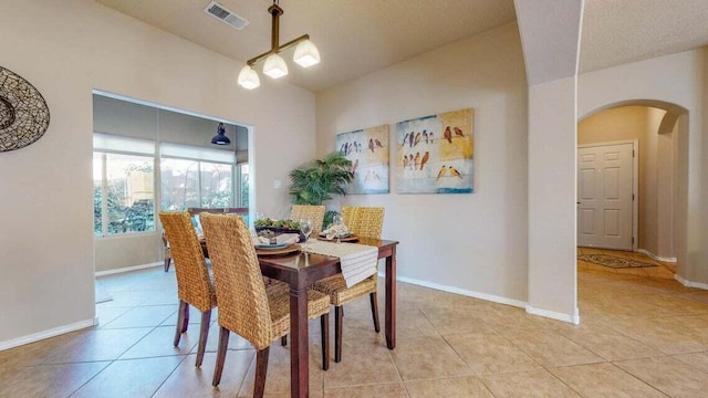 851 Vista Patron Dr, Bernalillo, NM 87004 - dining room featuring arched walkways and light tile patterned flooring