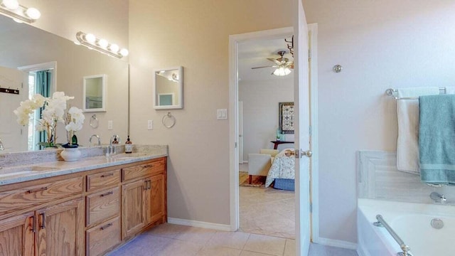 851 Vista Patron Dr, Bernalillo, NM 87004 - ensuite bathroom featuring double vanity, tile patterned flooring, a bath, and a ceiling fan