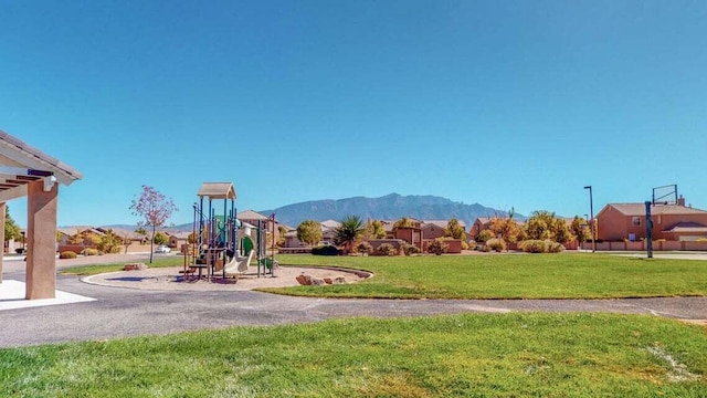 851 Vista Patron Dr, Bernalillo, NM 87004 - community play area with a lawn and a mountain view