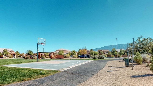 851 Vista Patron Dr, Bernalillo, NM 87004 - view of sport court with community basketball court, a mountain view, and a lawn