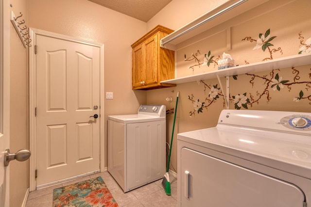851 Vista Patron Dr, Bernalillo, NM 87004 - laundry room featuring washer and dryer, cabinet space, and light tile patterned floors