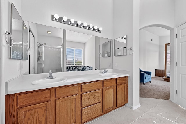 8905 Balsam Glade Rd NW, Albuquerque, NM 87114 - ensuite bathroom with a shower stall, double vanity, and tile patterned floors