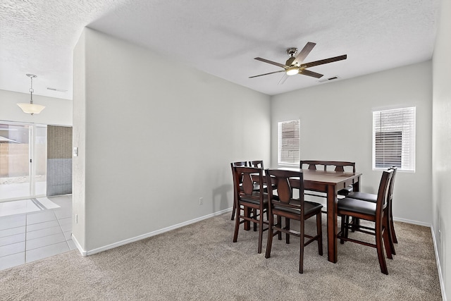 8905 Balsam Glade Rd NW, Albuquerque, NM 87114 - dining space with carpet flooring, a textured ceiling, and a ceiling fan