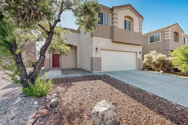 8905 Balsam Glade Rd NW, Albuquerque, NM 87114 - view of front of home featuring stucco siding, driveway, an attached garage, and a tiled roof