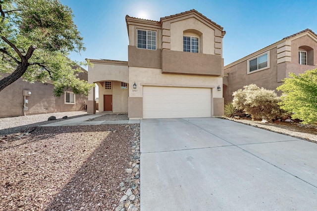 8905 Balsam Glade Rd NW, Albuquerque, NM 87114 - mediterranean / spanish-style house featuring stucco siding, a garage, driveway, and a tile roof
