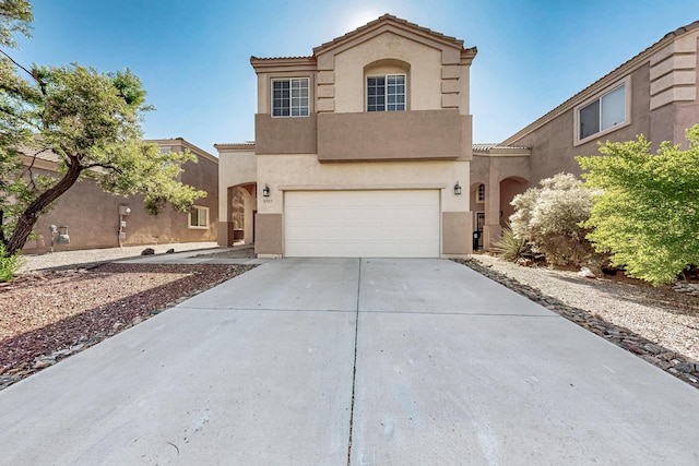 8905 Balsam Glade Rd NW, Albuquerque, NM 87114 - view of front of house featuring driveway, stucco siding, an attached garage, and a tile roof