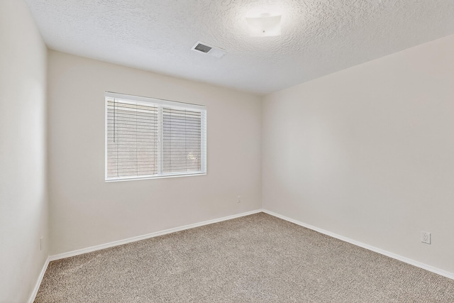 8905 Balsam Glade Rd NW, Albuquerque, NM 87114 - carpeted spare room with a textured ceiling and baseboards