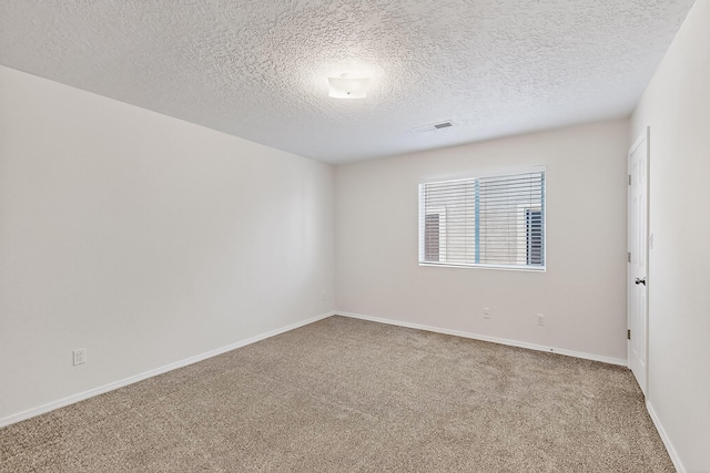 8905 Balsam Glade Rd NW, Albuquerque, NM 87114 - empty room with carpet flooring and a textured ceiling