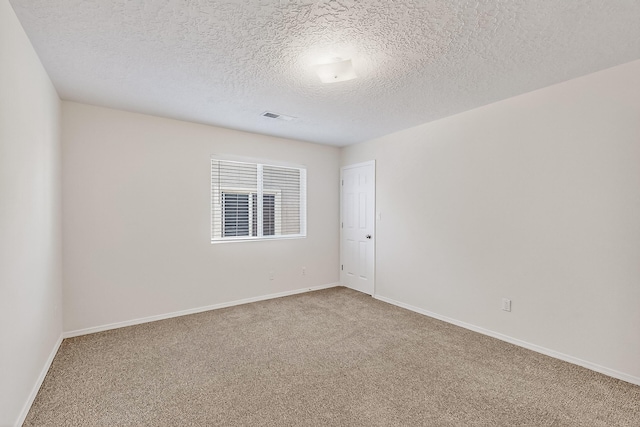 8905 Balsam Glade Rd NW, Albuquerque, NM 87114 - carpeted empty room with baseboards and a textured ceiling