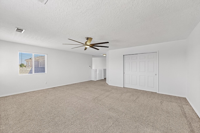 8905 Balsam Glade Rd NW, Albuquerque, NM 87114 - unfurnished bedroom featuring carpet flooring, a closet, ceiling fan, and a textured ceiling