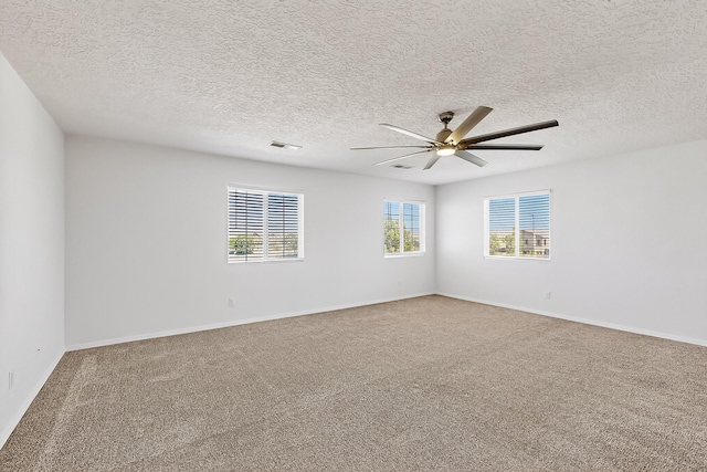 8905 Balsam Glade Rd NW, Albuquerque, NM 87114 - spare room featuring a ceiling fan, carpet flooring, and a textured ceiling
