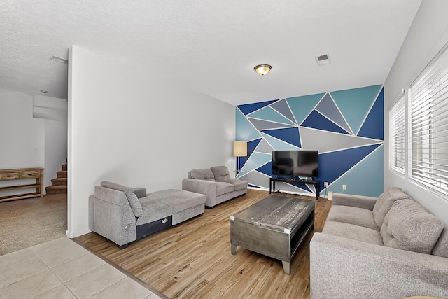8905 Balsam Glade Rd NW, Albuquerque, NM 87114 - living area with stairs and a textured ceiling