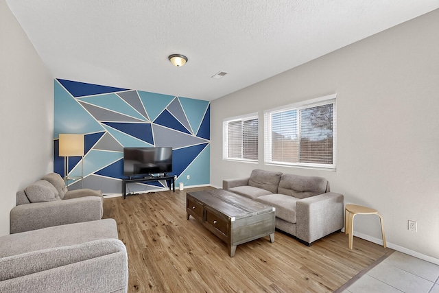 8905 Balsam Glade Rd NW, Albuquerque, NM 87114 - living room featuring baseboards and wood finished floors