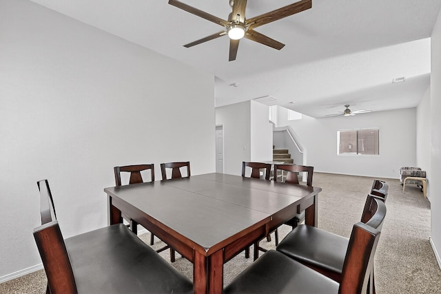 8905 Balsam Glade Rd NW, Albuquerque, NM 87114 - dining area featuring a ceiling fan, stairway, and carpet flooring