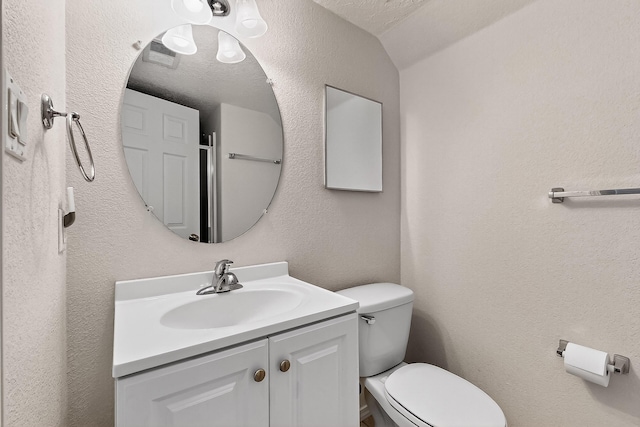8905 Balsam Glade Rd NW, Albuquerque, NM 87114 - bathroom featuring vanity and a textured wall