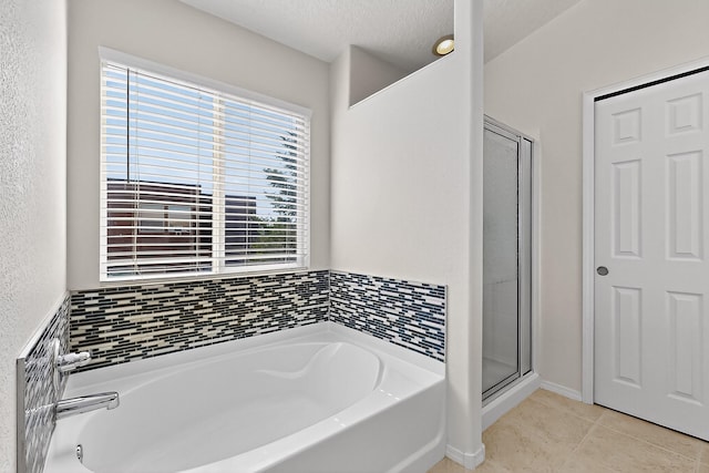 8905 Balsam Glade Rd NW, Albuquerque, NM 87114 - bathroom with a garden tub, a shower stall, tile patterned floors, and a textured ceiling