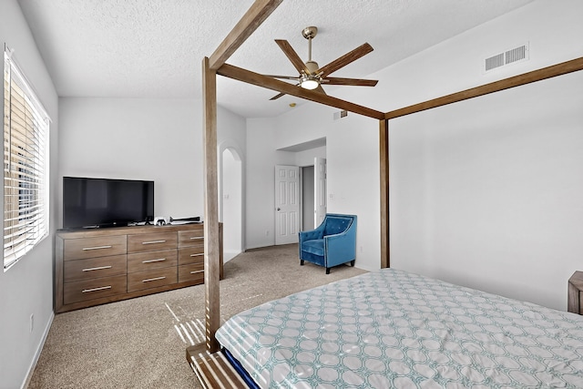 8905 Balsam Glade Rd NW, Albuquerque, NM 87114 - bedroom featuring light colored carpet, arched walkways, a ceiling fan, a textured ceiling, and a closet