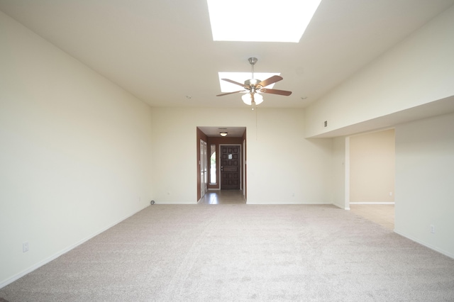 12910 Alice Ave NE, Albuquerque, NM 87112 - spare room with light colored carpet, a ceiling fan, and a skylight