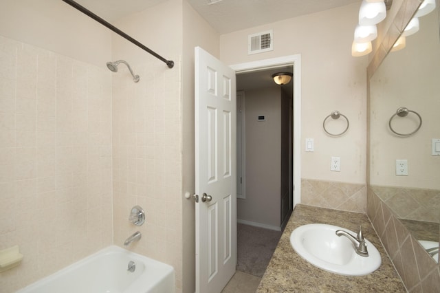 12910 Alice Ave NE, Albuquerque, NM 87112 - bathroom featuring vanity and washtub / shower combination