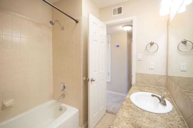 12910 Alice Ave NE, Albuquerque, NM 87112 - bathroom with shower / bathtub combination, tile patterned floors, and vanity