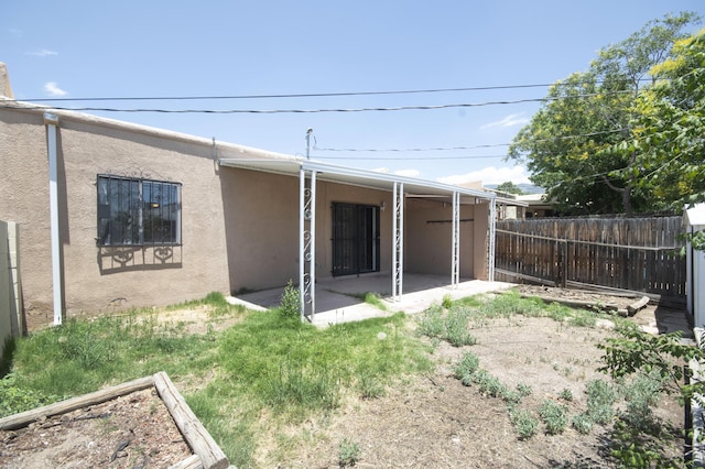 12910 Alice Ave NE, Albuquerque, NM 87112 - rear view of house with a patio area and stucco siding