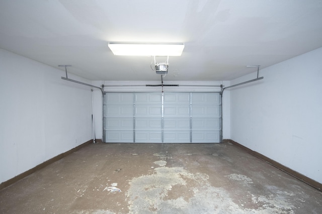 12910 Alice Ave NE, Albuquerque, NM 87112 - garage featuring baseboards and a garage door opener