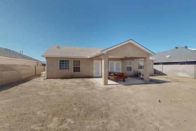 2062 Valley View Dr SW, Los Lunas, NM 87031 - rear view of house featuring stucco siding, a fenced backyard, and a patio