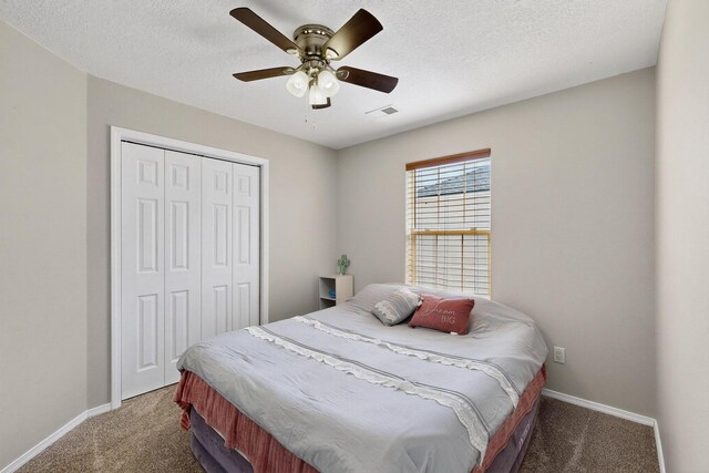 2062 Valley View Dr SW, Los Lunas, NM 87031 - carpeted bedroom featuring a closet, ceiling fan, and a textured ceiling