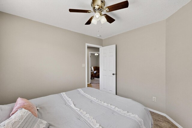 2062 Valley View Dr SW, Los Lunas, NM 87031 - bedroom with a ceiling fan and light colored carpet