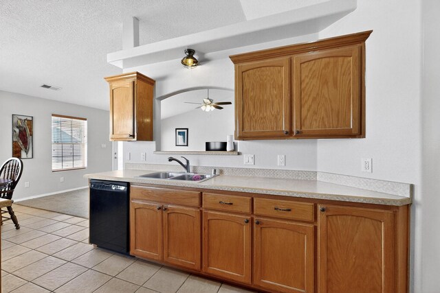 2062 Valley View Dr SW, Los Lunas, NM 87031 - kitchen featuring dishwasher, light countertops, ceiling fan, light tile patterned floors, and brown cabinetry