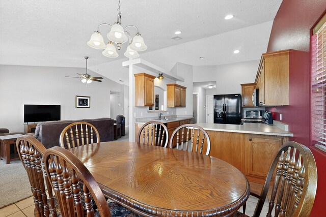 2062 Valley View Dr SW, Los Lunas, NM 87031 - dining area featuring ceiling fan, light tile patterned flooring, a chandelier, lofted ceiling, and recessed lighting