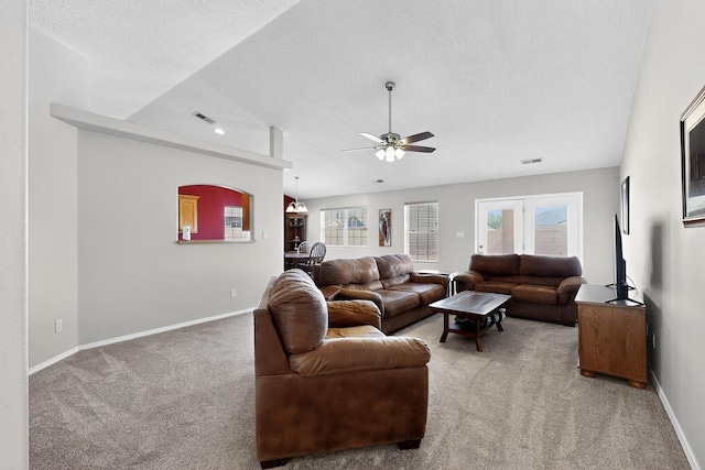 2062 Valley View Dr SW, Los Lunas, NM 87031 - carpeted living room with ceiling fan and a textured ceiling