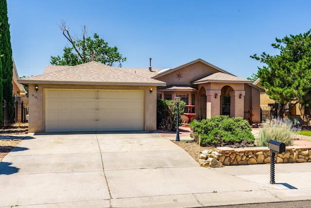 5131 Gaviota NW, Albuquerque, NM 87120 - view of front of property with stucco siding, driveway, and a garage