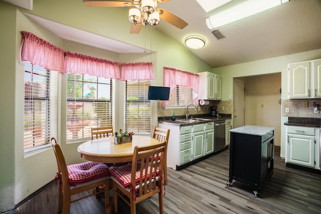 5131 Gaviota NW, Albuquerque, NM 87120 - kitchen featuring vaulted ceiling, decorative backsplash, ceiling fan, dark wood-type flooring, and dishwasher