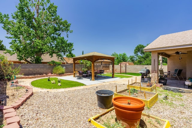 5131 Gaviota NW, Albuquerque, NM 87120 - fenced backyard with a gazebo, a patio, a ceiling fan, and a storage unit