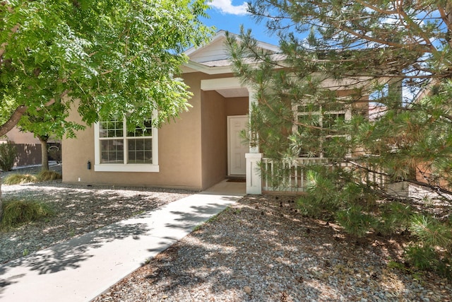 5723 Strand Loop SE, Albuquerque, NM 87106 - property entrance with stucco siding