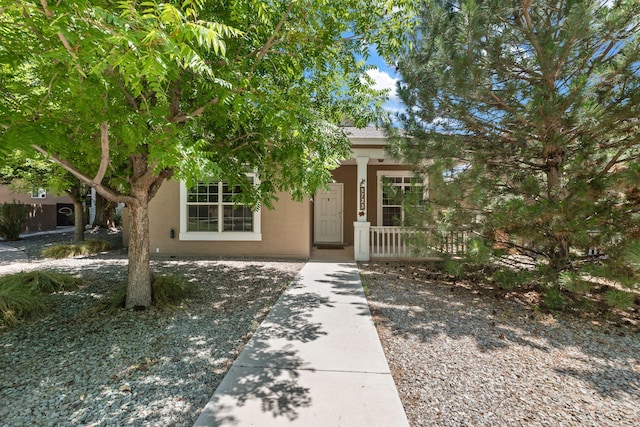 5723 Strand Loop SE, Albuquerque, NM 87106 - view of front of property with covered porch and stucco siding