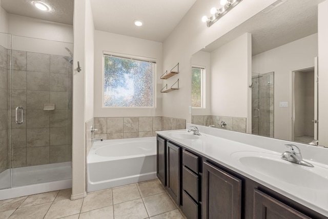 5723 Strand Loop SE, Albuquerque, NM 87106 - full bath featuring a stall shower, double vanity, a garden tub, and tile patterned flooring