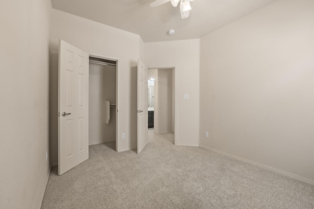 5723 Strand Loop SE, Albuquerque, NM 87106 - unfurnished bedroom featuring light carpet, a ceiling fan, and a closet