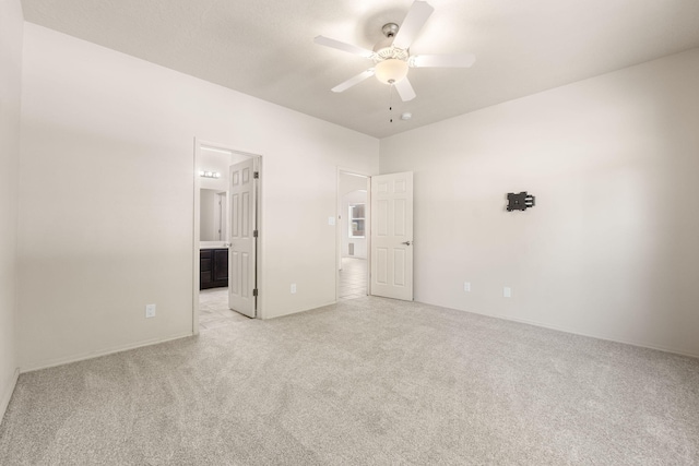 5723 Strand Loop SE, Albuquerque, NM 87106 - unfurnished bedroom featuring light carpet, ensuite bathroom, and ceiling fan
