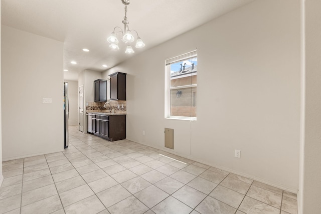 5723 Strand Loop SE, Albuquerque, NM 87106 - interior space featuring a chandelier, light tile patterned floors, and recessed lighting