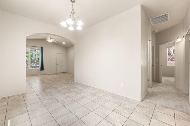 5723 Strand Loop SE, Albuquerque, NM 87106 - unfurnished room with arched walkways, a chandelier, light tile patterned floors, and ceiling fan
