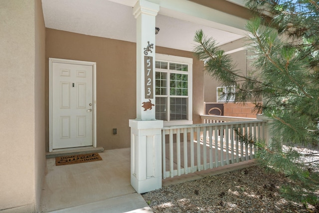 5723 Strand Loop SE, Albuquerque, NM 87106 - entrance to property with a porch and stucco siding