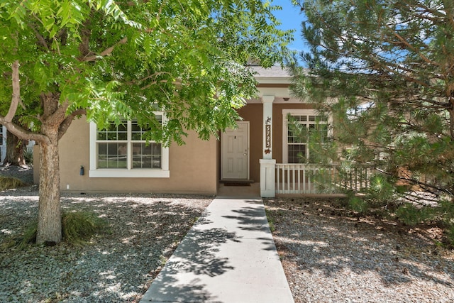 5723 Strand Loop SE, Albuquerque, NM 87106 - entrance to property with covered porch and stucco siding