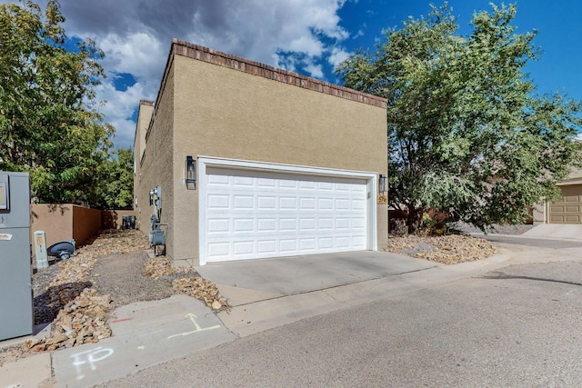 5716 Strand Loop SE, Albuquerque, NM 87106 - view of front of home featuring stucco siding and a garage