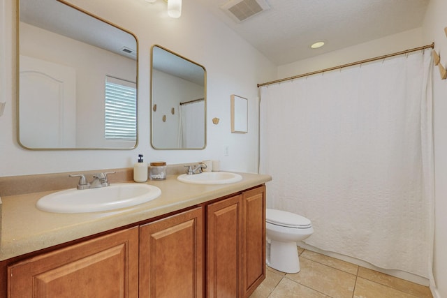 5716 Strand Loop SE, Albuquerque, NM 87106 - bathroom featuring tile patterned floors, double vanity, and curtained shower