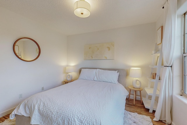 5716 Strand Loop SE, Albuquerque, NM 87106 - bedroom featuring wood finished floors and baseboards