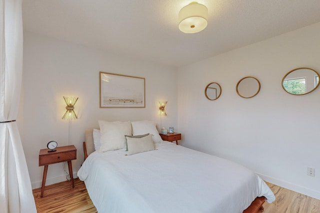 5716 Strand Loop SE, Albuquerque, NM 87106 - bedroom featuring light wood-style flooring and fridge